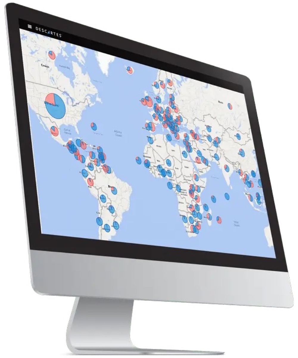 Descartes Datamyne global trade heat map on a monitor showing import and export volume by country as color-coded pie charts across North America, Europe, Africa and Asia