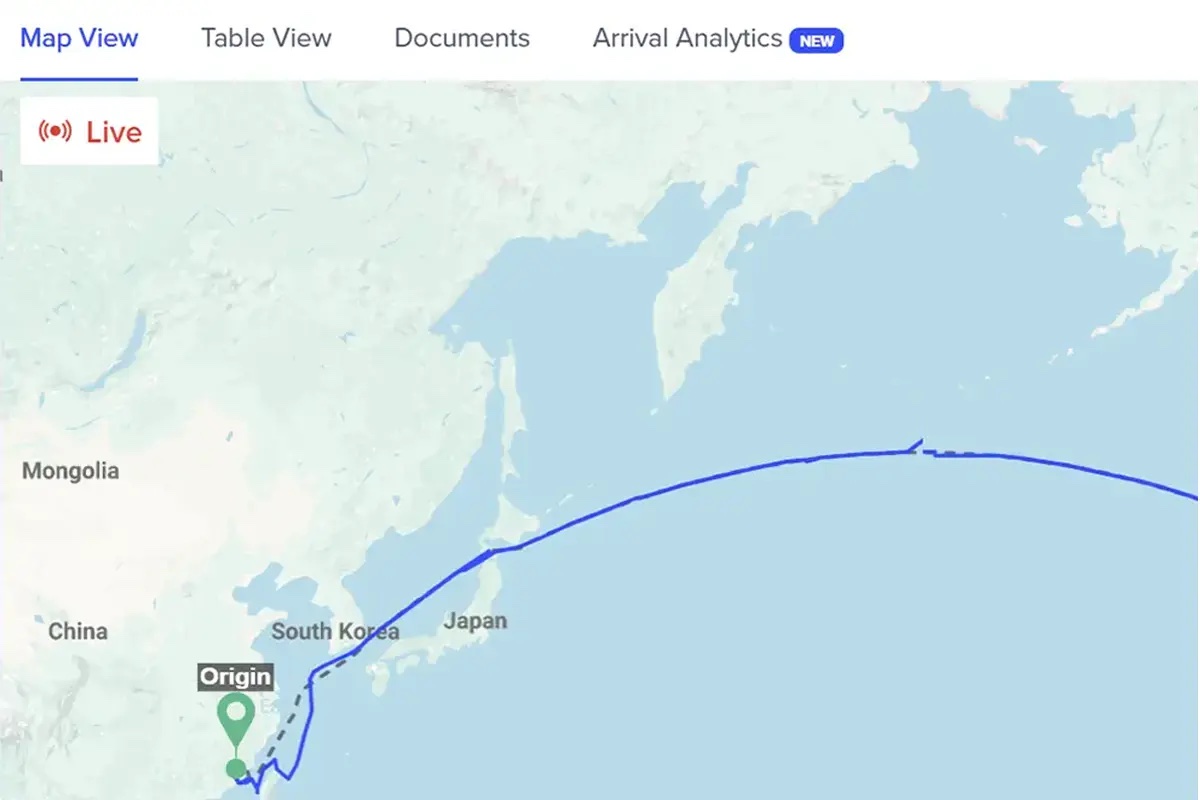 GoComet GoTrack live shipment tracking map showing an origin in South Korea, a transshipment point, and a destination in the United States with a Live status indicator